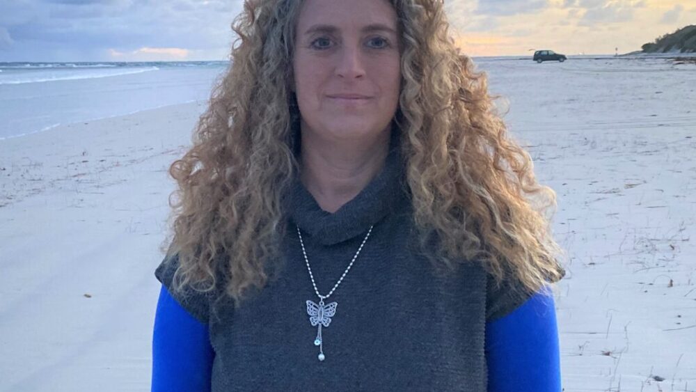 Lady standing on beach