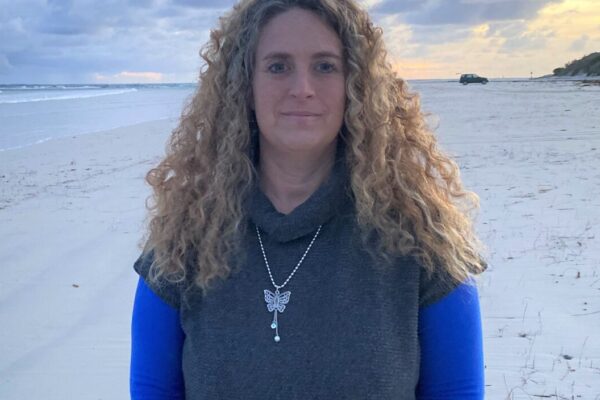 Lady standing on beach